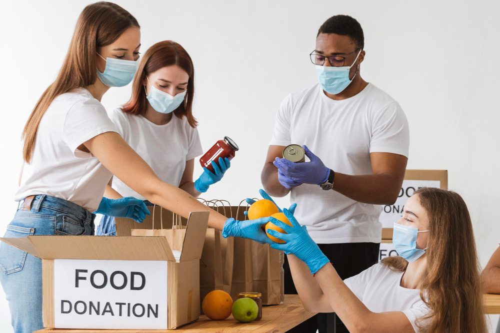 volunteers-with-medical-masks-preparing-donation-boxes